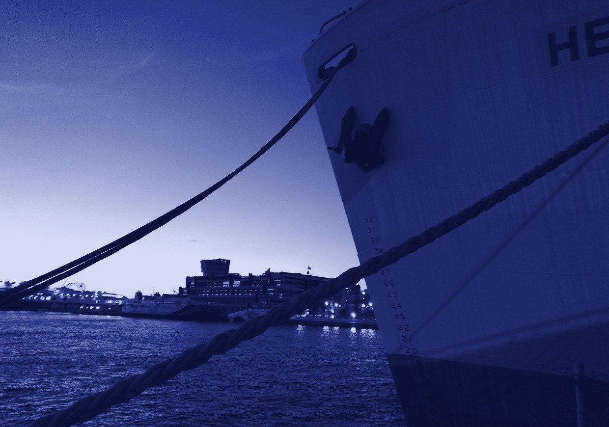 Bow of a moored vessel at dusk